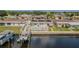 Waterfront home boasts a private dock, pool, and patio, perfect for relaxing and entertaining at 1118 Lodestar Dr, Holiday, FL 34690