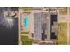 Aerial view of a waterfront home featuring a pool, dock, and solar panels at 1118 Lodestar Dr, Holiday, FL 34690