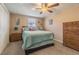 Comfortable bedroom with plush carpet, cozy bedding, and ample closet space at 1118 Lodestar Dr, Holiday, FL 34690