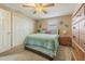 Comfortable bedroom with plush carpet, cozy bedding, and ample closet space at 1118 Lodestar Dr, Holiday, FL 34690