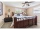 Cozy bedroom featuring a wooden bed frame, soft lighting, and plush carpet at 1118 Lodestar Dr, Holiday, FL 34690