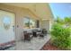 Inviting front porch with wicker seating, perfect for enjoying the outdoors at 1118 Lodestar Dr, Holiday, FL 34690
