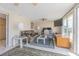 Living room with tile floors, a ceiling fan and sliding glass doors to the outside at 1118 Lodestar Dr, Holiday, FL 34690