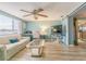 Inviting living room with comfortable seating, natural light and sliding door to the kitchen at 1118 Lodestar Dr, Holiday, FL 34690