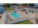 Pool with an expansive pool deck, BBQ grill, and a serene waterfront view at 1118 Lodestar Dr, Holiday, FL 34690