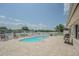 Beautiful kidney-shaped pool with an expansive pool deck and views of the water at 1118 Lodestar Dr, Holiday, FL 34690