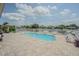 Beautiful kidney-shaped pool with an expansive pool deck for entertaining at 1118 Lodestar Dr, Holiday, FL 34690
