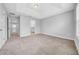 Spacious bedroom with tray ceiling, carpeted floors and an ensuite bathroom at 11728 Cambium Crown Dr, Riverview, FL 33569