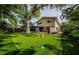 This property has a backyard oasis with putting green, mature trees and ample space for relaxation at 1210 Bay Pine Blvd, Indian Rocks Beach, FL 33785