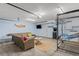 Entertainment room with comfortable seating, arcade game, and TV at 1210 Bay Pine Blvd, Indian Rocks Beach, FL 33785