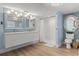 Bright bathroom boasts a double vanity, shower, and modern fixtures at 1210 Bay Pine Blvd, Indian Rocks Beach, FL 33785