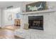 Living room fireplace with stone surround, decorative mantel, and beach-themed decor at 1210 Bay Pine Blvd, Indian Rocks Beach, FL 33785