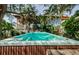 Secluded hot tub surrounded by lush tropical landscaping, creating a private oasis in the backyard at 1210 Bay Pine Blvd, Indian Rocks Beach, FL 33785