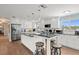 Modern kitchen with stainless steel appliances, ample counter space, and island seating at 1210 Bay Pine Blvd, Indian Rocks Beach, FL 33785