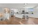 Bright kitchen boasts white cabinetry and a central island with bar seating at 1210 Bay Pine Blvd, Indian Rocks Beach, FL 33785
