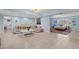 Bright living area featuring tile floors, neutral seating, coastal decor, and a bedroom view at 1210 Bay Pine Blvd, Indian Rocks Beach, FL 33785