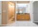 Well-lit bathroom with double vanity, granite countertop, and separate toilet room at 12204 Coldstream Ln, Tampa, FL 33626