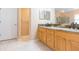 Bathroom featuring granite countertops, double vanity, and a large glass shower at 12204 Coldstream Ln, Tampa, FL 33626