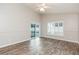 Bedroom features laminate floors, and sliding glass doors leading to the pool at 12204 Coldstream Ln, Tampa, FL 33626