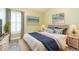Bright bedroom features beach themed decor, natural light, and wicker furniture at 12204 Coldstream Ln, Tampa, FL 33626