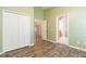 Bedroom features natural light, laminate flooring, and closet at 12204 Coldstream Ln, Tampa, FL 33626