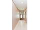 Inviting foyer with a decorative front door, tile flooring, and neutral wall paint at 12204 Coldstream Ln, Tampa, FL 33626