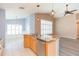 Bright kitchen with a stainless dishwasher and granite island at 12204 Coldstream Ln, Tampa, FL 33626