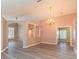 Open living space with wood floors, neutral walls, archways and lots of light at 12204 Coldstream Ln, Tampa, FL 33626