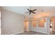 Open living area featuring light colored walls and gray floors at 12204 Coldstream Ln, Tampa, FL 33626