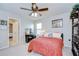 Comfortable bedroom features include a ceiling fan, decor, and an adjacent entry at 13111 Bahia Grass Ln, Riverview, FL 33579