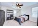 Relaxing bedroom with ceiling fan, furniture, and plenty of natural light at 13111 Bahia Grass Ln, Riverview, FL 33579