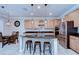 Spacious kitchen with granite island, stainless steel appliances, and pendant lighting at 13111 Bahia Grass Ln, Riverview, FL 33579