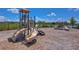Community playground with slides and climbing structures, perfect for Gathering fun at 13111 Bahia Grass Ln, Riverview, FL 33579