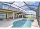 Relaxing pool and spa in a screened-in lanai next to the covered patio space at 13111 Bahia Grass Ln, Riverview, FL 33579