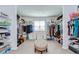 Large walk-in closet with custom shelving and ample storage space at 13111 Bahia Grass Ln, Riverview, FL 33579