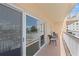 Relax on this expansive balcony with beautiful views from comfortable seating for outdoor living at 13440 Gulf Blvd # 202, Madeira Beach, FL 33708
