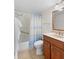Bathroom featuring vanity, toilet, and shower with beach themed curtain at 13440 Gulf Blvd # 202, Madeira Beach, FL 33708