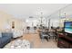 An open living area combines the kitchen, dining, and living spaces at 13440 Gulf Blvd # 202, Madeira Beach, FL 33708