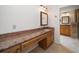 Bathroom with vanity and granite countertop, tile flooring, and access to a shower at 14175 Feather Sound Dr, Clearwater, FL 33762
