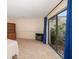 Bright bedroom with sliding glass doors that offer peaceful views of an enclosed courtyard at 14175 Feather Sound Dr, Clearwater, FL 33762
