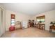 Spacious bedroom with tan tile flooring and neutral walls at 14175 Feather Sound Dr, Clearwater, FL 33762