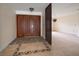 Welcoming foyer featuring decorative tile flooring and an impressive double-door entry at 14175 Feather Sound Dr, Clearwater, FL 33762