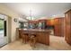 Well-appointed kitchen featuring granite countertops and custom cabinetry, perfect for cooking and entertaining at 14175 Feather Sound Dr, Clearwater, FL 33762