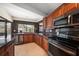 Spacious kitchen features granite countertops, stainless steel appliances, and ample cabinet space at 14175 Feather Sound Dr, Clearwater, FL 33762