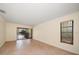 Bright living room with sliding glass doors to lanai and backyard at 14175 Feather Sound Dr, Clearwater, FL 33762