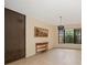 Bright living room with neutral walls, tile flooring, and a decorative screen at 14175 Feather Sound Dr, Clearwater, FL 33762