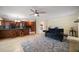 Open floor plan: view of kitchen, breakfast bar, and comfortable living room space at 14175 Feather Sound Dr, Clearwater, FL 33762