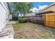Backyard with a wooden fence and a storage shed at 15604 Deerglen Dr, Tampa, FL 33624
