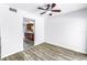 Open dining room area with hardwood flooring and view of kitchen at 15604 Deerglen Dr, Tampa, FL 33624