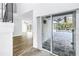 Entryway with tile flooring, offering a view of the living area and the outdoor pool area at 15604 Deerglen Dr, Tampa, FL 33624